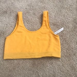 Mustard yellow stretchy sports bra